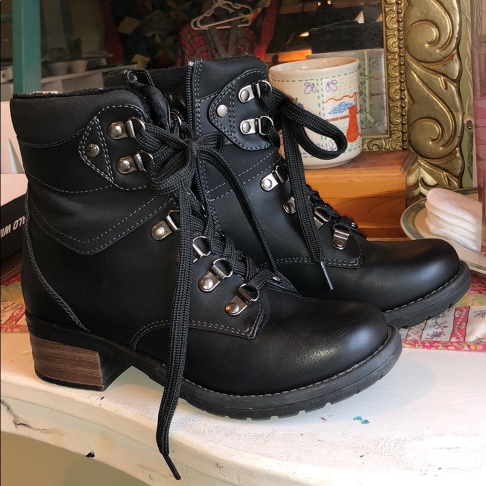 black laced boots with a short heel and zipper